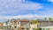 Pano Blue sky and clouds over homes at the prestigious community of Huntington Beach