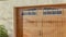 Pano Brown glass paned wooden garage door of home in Huntington Beach California