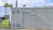 Pano Building with flat roof and gray exterior wall in Huntington Beach California