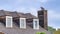 Pano Dormer windows on gray roof of house with chimney in San Diego California