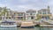 Pano Elegant houses with view of boats on canal in Long Beach California neighborhood