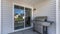 Pano Exterior of a house with a sliding glass door and vinyl sidings