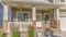 Pano Exterior of sunlit home with pathway and stairs leading to porch and front door