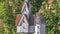 Pano frame Close up of a beautiful birdhouse surrounded by colorful flowers and leaves