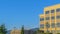 Pano frame Empty parking lot with buildings mountain and blue sky view on a sunny day