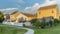 Pano frame Pathway on lush green grassy ground in front of houses with balconies and stairs