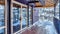 Pano Front deck of building with double glass door and snow on the wooden floor