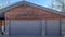 Pano Gabled garage of home in Park City Utah with two gray doors at teh entrance