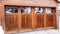 Pano Garage exterior with snowy gable roof over glass paned door and wooden wall.