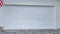 Pano Garage of house in San Diego California with white door and wall cladding