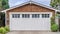 Pano Garage in San Diego California with white door and brown wall under gable roof