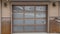 Pano Glass paned garage door of home in the mountain blanketed with snow in winter