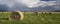 A pano of hay in a field.