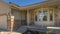 Pano Home facade with bay window concrete porch landscaped yard and gabled garage