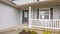 Pano Home with front porch glass panels on door and windows with wooden shutters