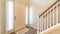 Pano Home interior with stairs in front of the white front door flanked by sidelights
