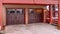 Pano House with snowy roof and balcony in winter above attached two car garage