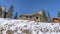 Pano Mountain houses viewed from the bottom of the slope covered with snow in winter