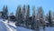 Pano Mountain scenery in Park City Utah with homes and trees on snow covered slopes