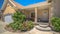 Pano Pathway leading to garage and stairs of a home with porch and landscaped yard