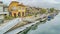 Pano Picturesque canal with boats and docks along walkways and houses in Long Beach