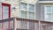 Pano Residential building with small balcony accessed through glass paned red door