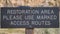 Pano Restoration Area sign agaisnt desert landscape at Joshua Tree National Park