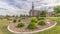 Pano Scenic view of church with white steeple and landscaped yard on a cloudy day