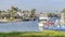 Pano Seaside city in Huntington Beach California with houses around water with boats