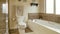 Pano Shower stall toilet and built in bathtub inside bathroom with warm toned tiles