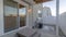 Pano Sliding glass door and wooden steps at the back of a home with wooden fence