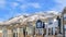 Pano Snowy peak of Wasatch Mountains behind houses in the sunny valley neighborhood