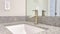 Pano Stainless steel faucet over single basin undermount sink of residential bathroom