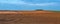 panoram of plowed field and soybean brown field in autumn , patchwork and field lines, geometry