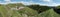 Panorama with abandoned barracks below of summit of Slatnik in Julian Alps in Slovenia