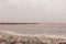 Panorama of an abandoned salt mine on a pink lake.