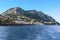 A panorama across the breakwater of the harbour of Marina Grande with Mount Solaro and Anacapri in the distance on the island of
