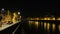 panorama of the Adige river in Verona at night with reflections of the lights