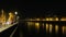 panorama of the Adige river in Verona at night with reflections of the lights