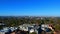 Panorama aerial drone view of suburban Sydney CBD Skyline residential housing and street scapes parks and roads of NSW Australia