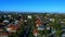 Panorama aerial drone view of suburban Sydney CBD Skyline residential housing and street scapes parks and roads of NSW Australia