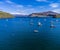 A panorama aerial view of boats moored in the bay of Portree on the Isle of Skye, Scotland