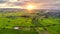 Panorama of aerial view at sunset over mountain on rice fields