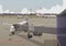 Panorama of the airport, a telescopic ladder is attached to the aircraft. Vector