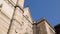 Panorama of ancient facade of Naples cathedral, view on marble statues, sequence