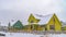 Panorama Appealing homes amid an icy landscape on a cloudy winter day in Daybreak