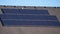 Panorama Array of solar panels on a house roof in close up