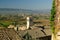 Panorama of the Assisi countryside with churches, houses and trees. From the top of the city you can enjoy a splendid view