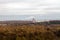 Panorama of an autumn forest on the outskirts of the city.