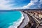 Panorama. Azure sea, waves, English promenade and people resting. Rest and relaxation by the sea.